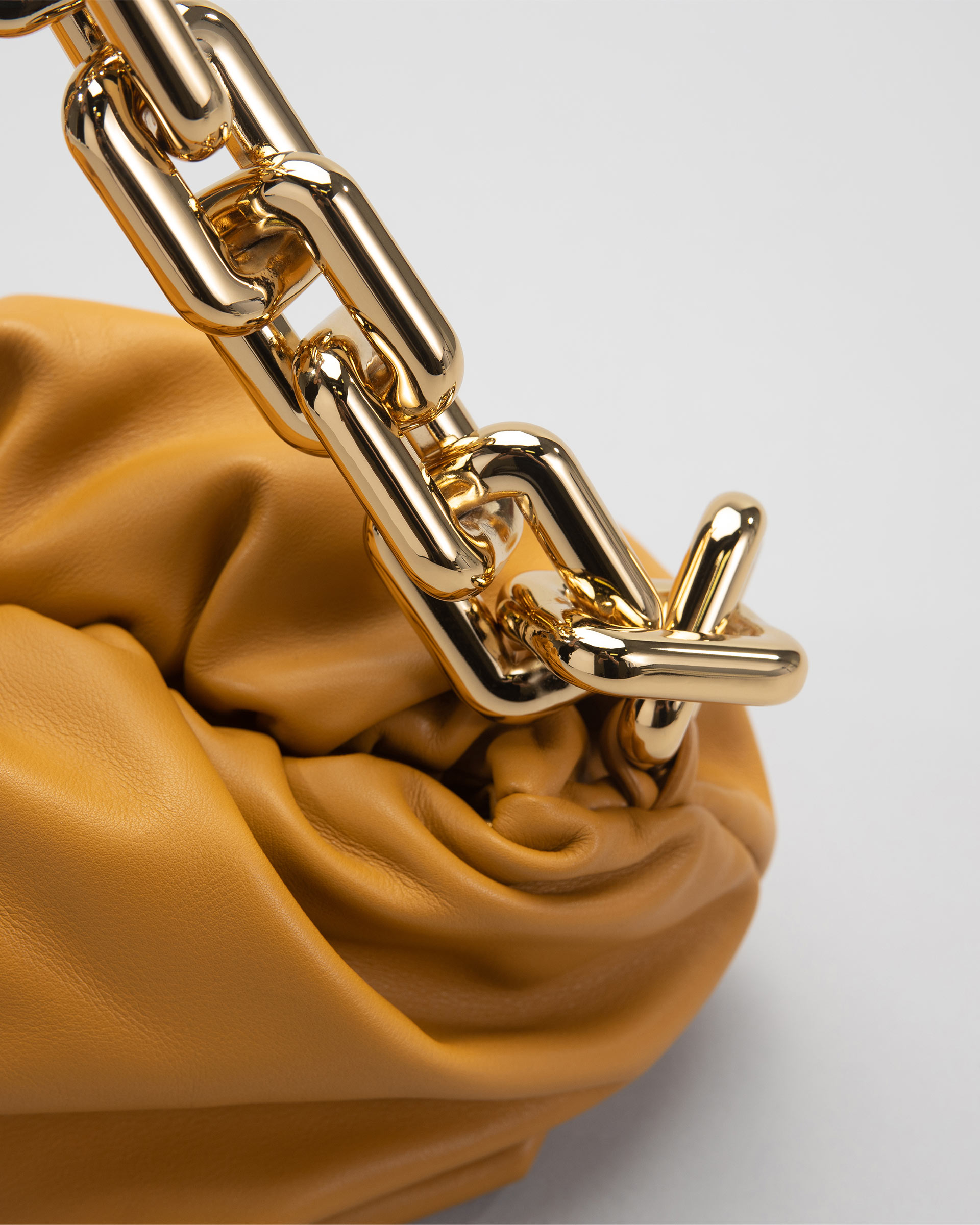 Close up product image of Bottega Veneta The Pouch chain FASHIONPHILE