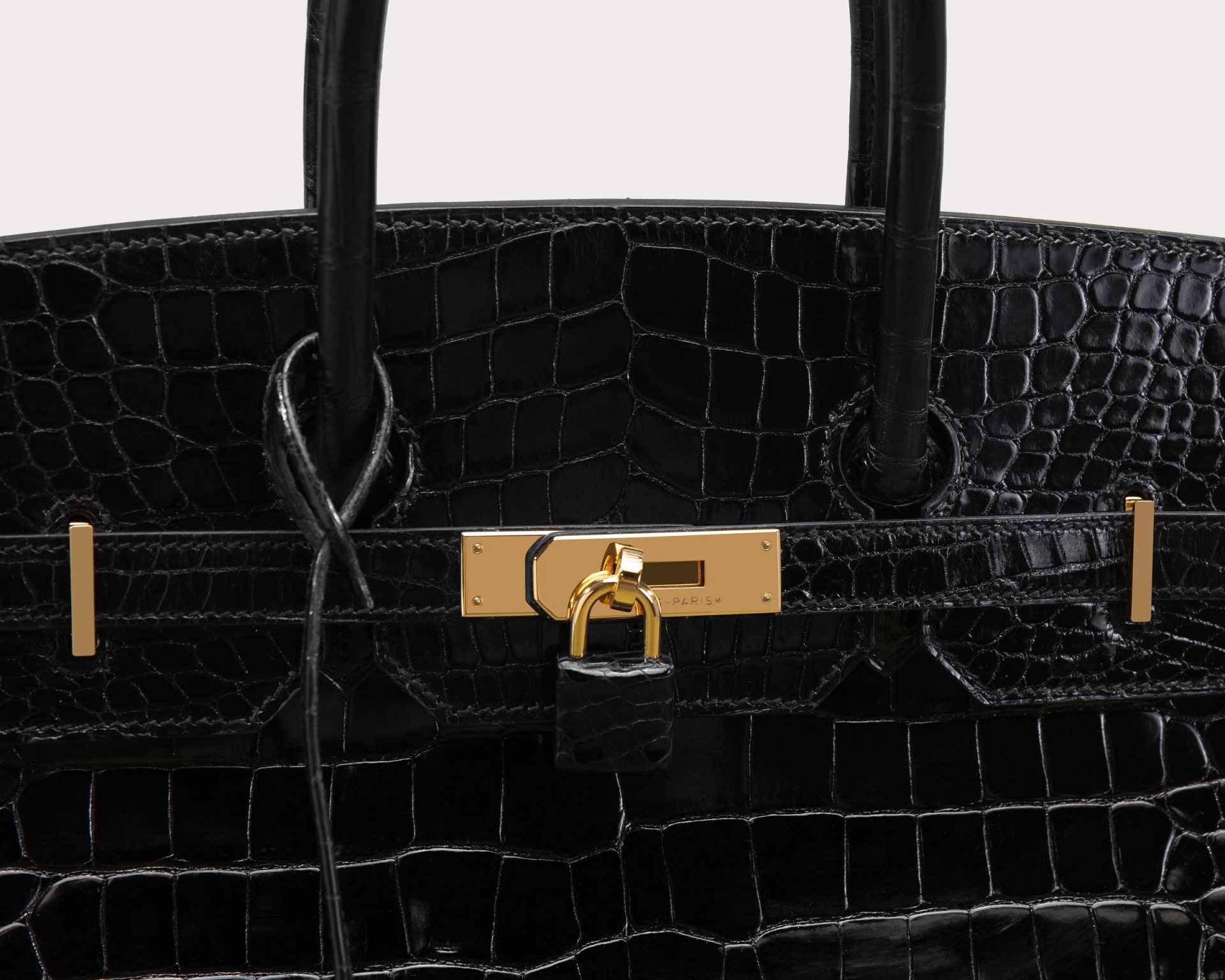 close up product image of black Hermes crocodile Birkin bag at FASHIONPHILE