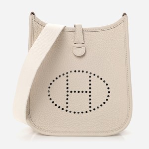 product image of cream Hermes Evelyne TPM bag FASHIONPHILE